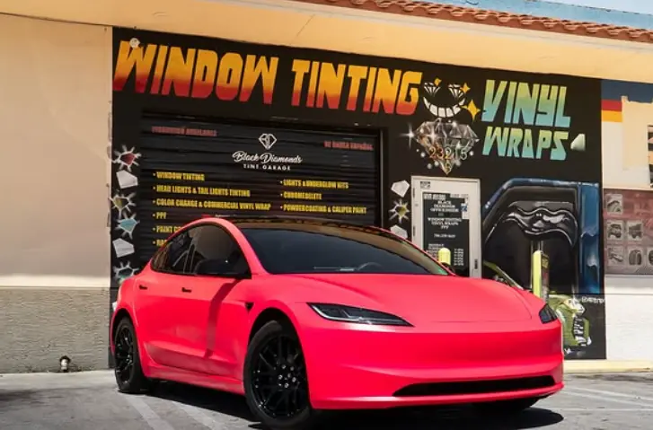 Tesla Car Wrap Front Of Shop Coral by Black Diamonds Tinting Garage