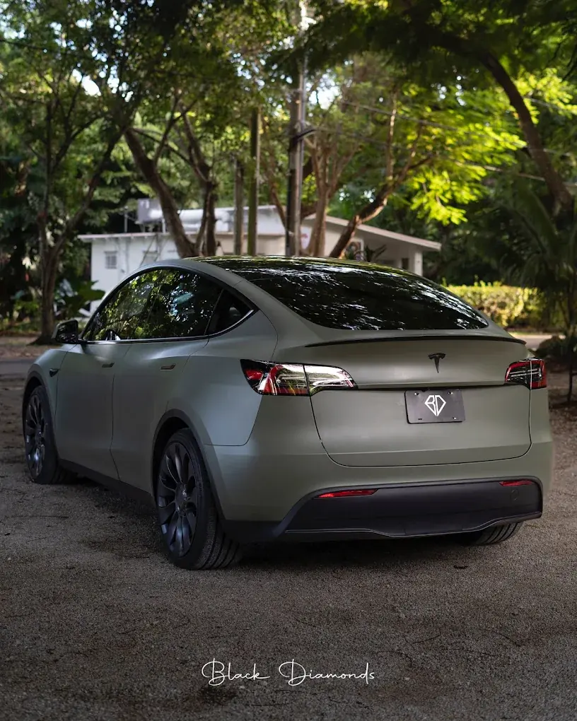 Tesla Model Y in a matte green wrap
