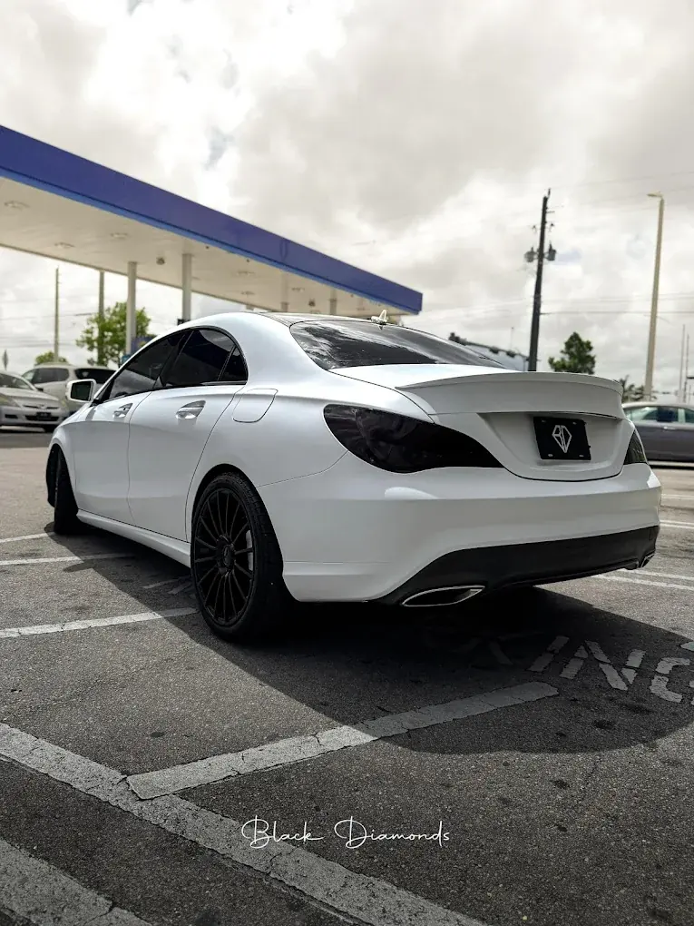 White car with headlight tint